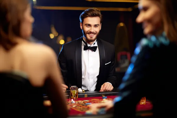 A glowing roulette wheel with cascading chips, symbolizing the engaging live and instant-win games available on 520JL.