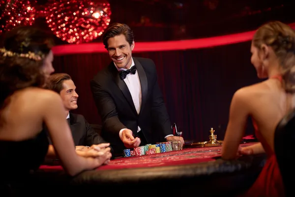 520JL Login — Instantly access your secure account A confident dealer surrounded by casino chips inviting players to access their 520JL account, reflecting quick and easy login options.