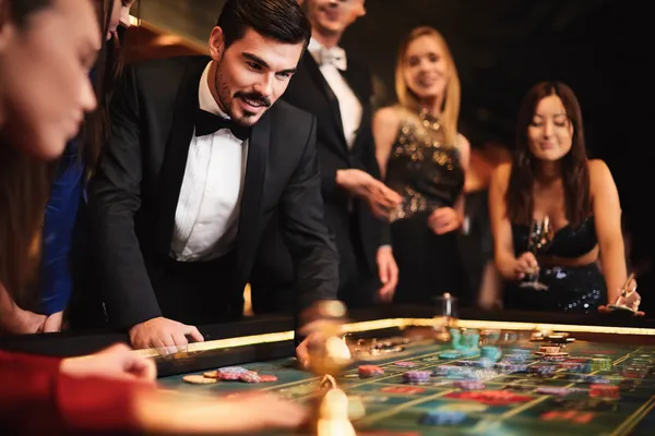 520JL Member Login — Return to your personalized dashboard A person using their device against a moody casino-themed background, illustrating the smooth re-entry process at 520JL.